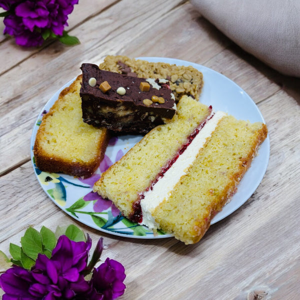 Four pieces of delicious cake in a personalised treat tin