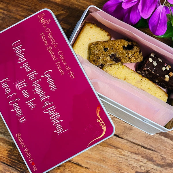 Four pieces of delicious cake in a personalised treat tin