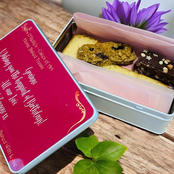 Four pieces of delicious cake in a personalised treat tin