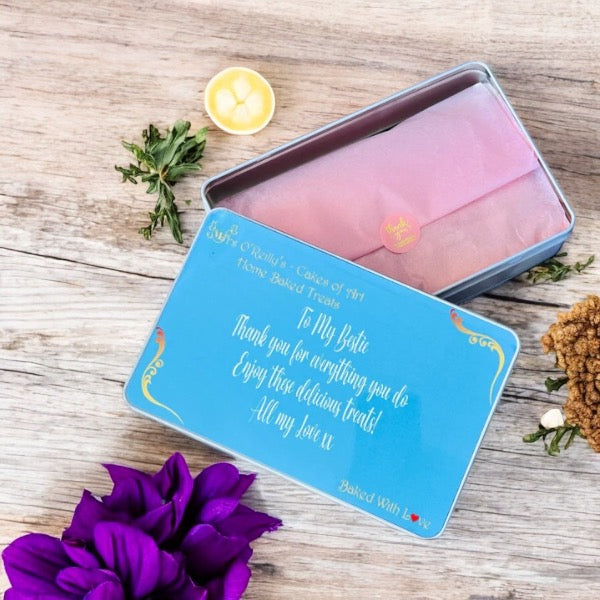 Four pieces of delicious cake in a personalised treat tin